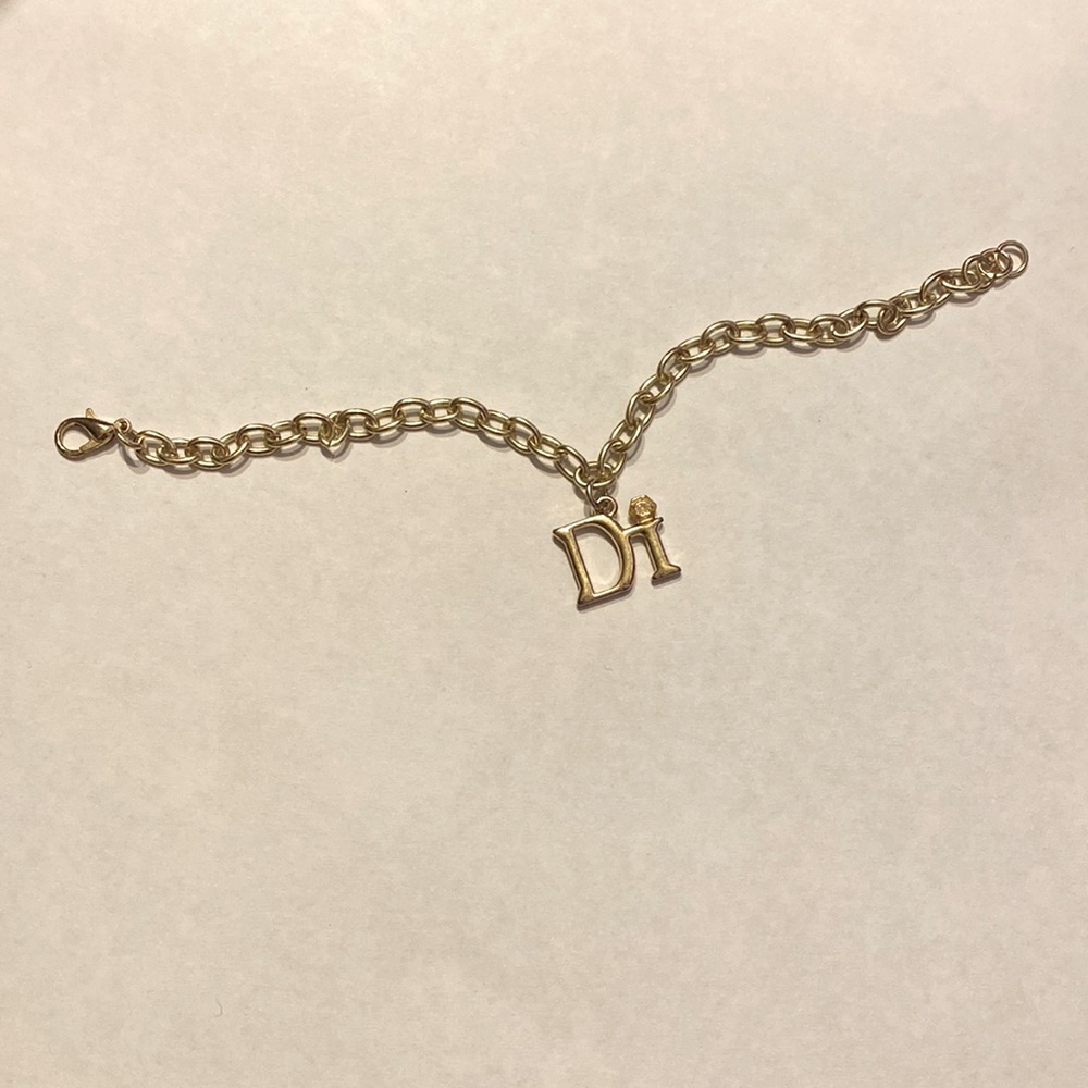 Chain bracelet can be for charms has a Di charm already gold tone